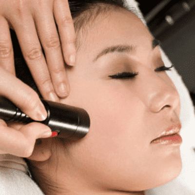 Beautiful woman relaxing and getting head massage.